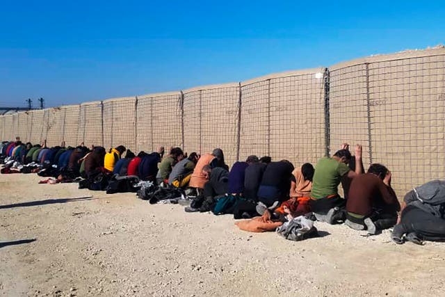 <p>A photo provided by the Kurdish-led Syrian Democratic Forces shows arrested Isis fighters after they attacked Gweiran Prison</p>