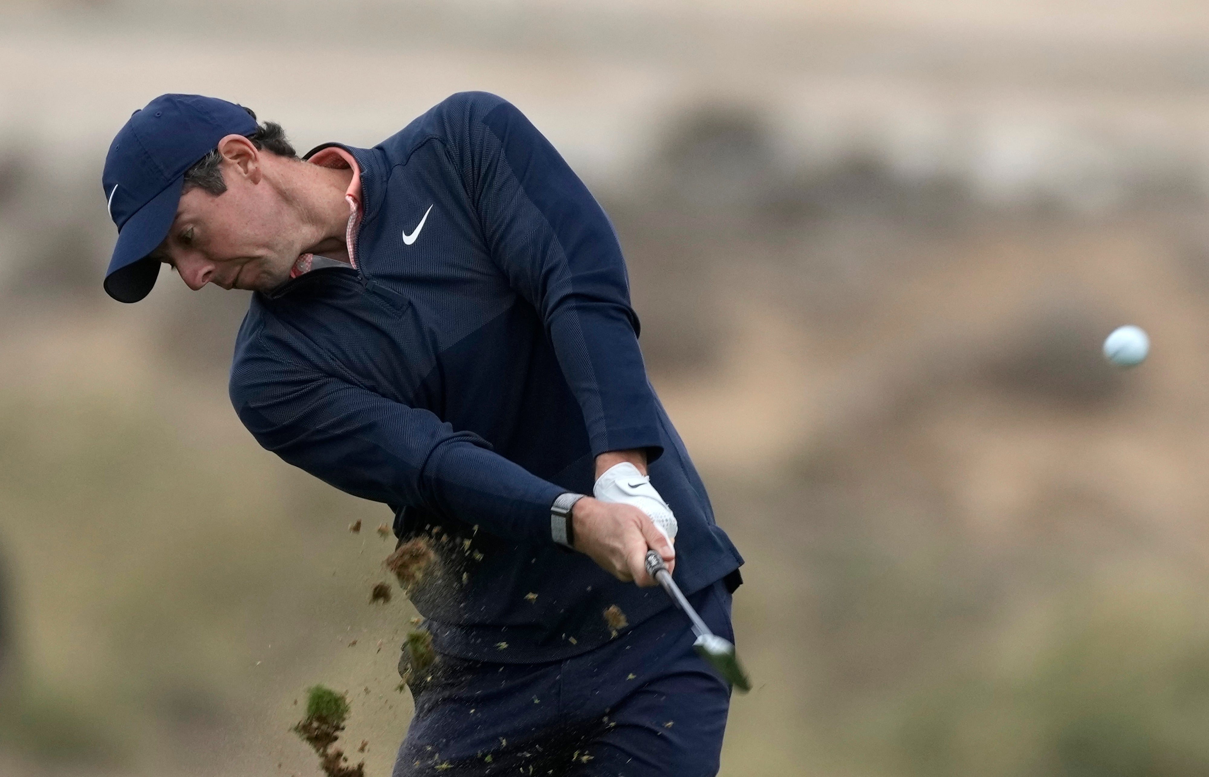 Rory McIlroy battled to a second round of 75 on a windswept day at the Abu Dhabi Championship (Kamran Jebreili/AP)