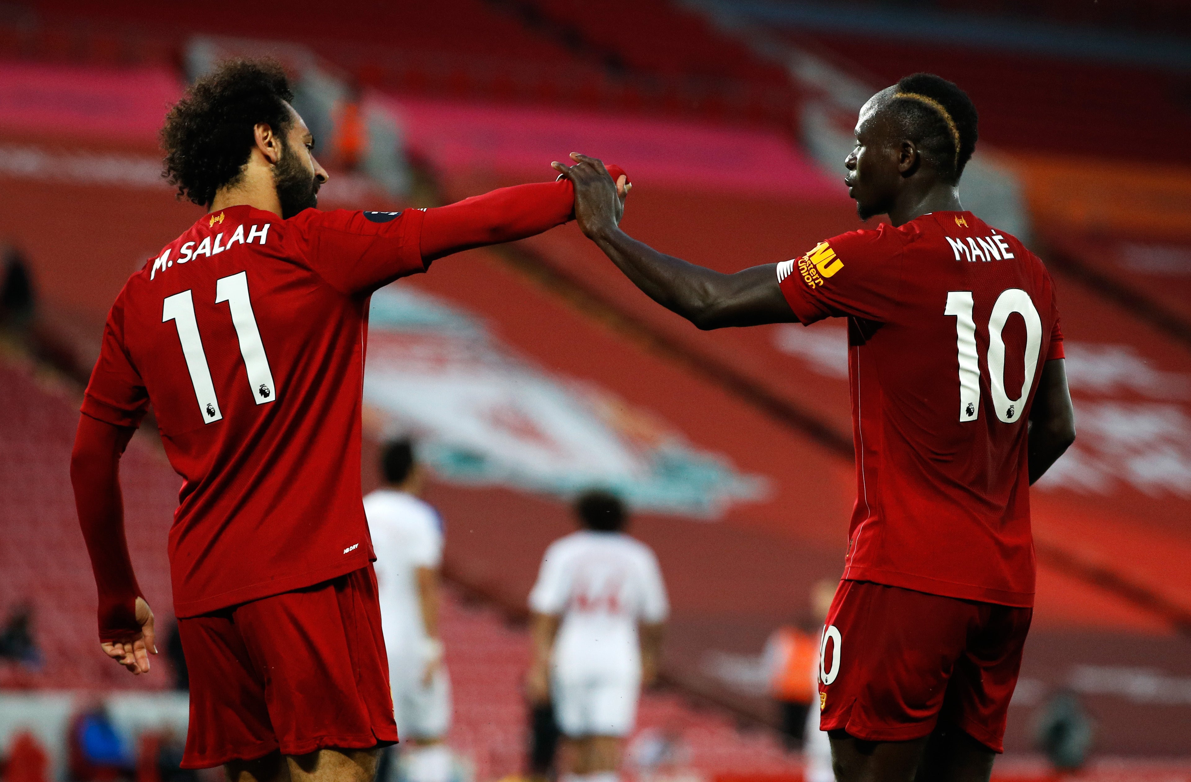 Sadio Mane and Mohamed Salah celebrate a goal for Liverpool against Crystal Palace (Phil Noble/NMC Pool/PA)