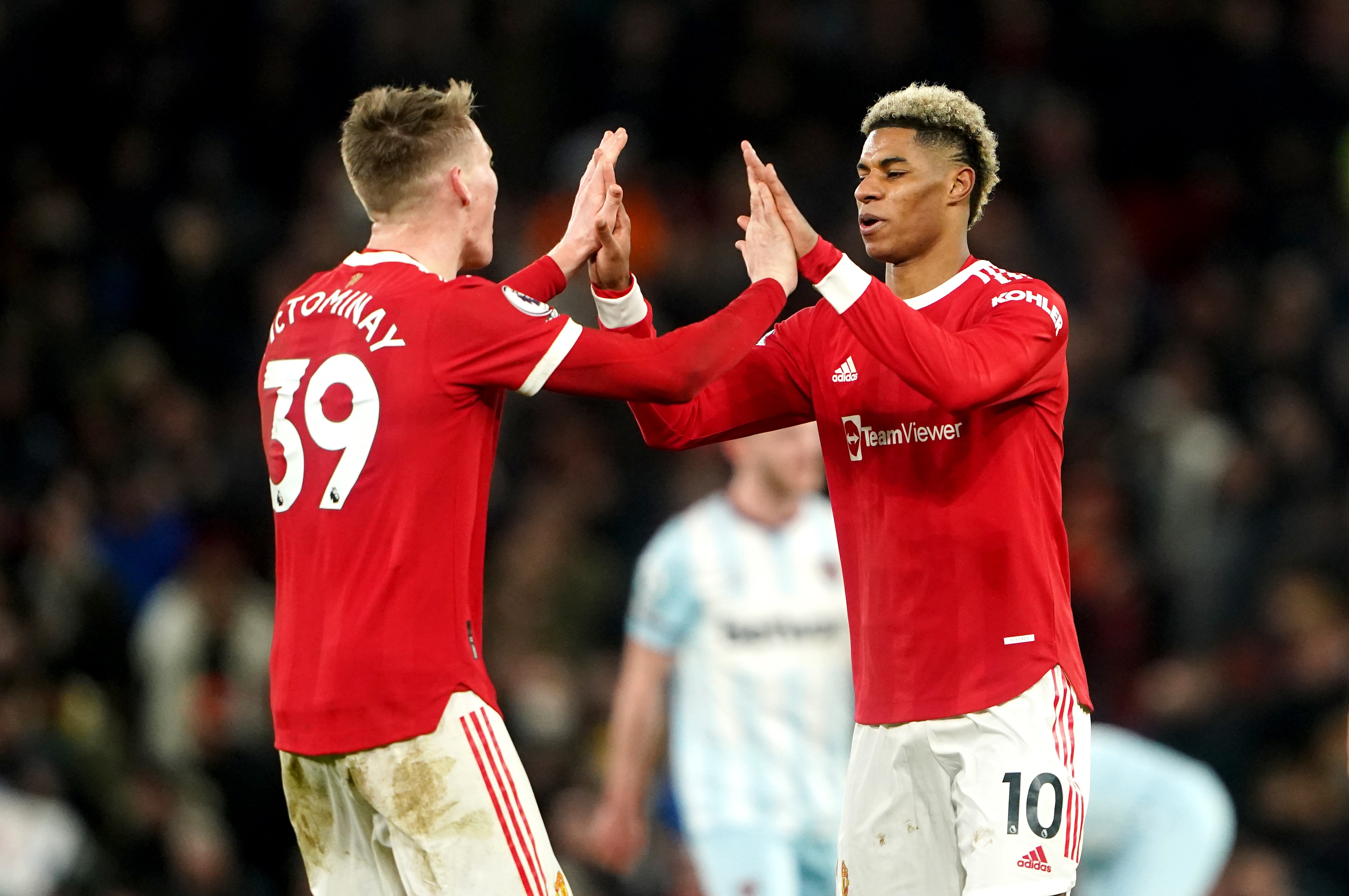 Manchester United’s Scott McTominay and Marcus Rashford celebrate (Zac Goodwin/PA)