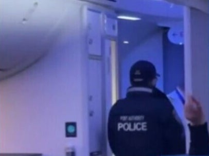 Police boarded the flight to arrest two unruly passengers