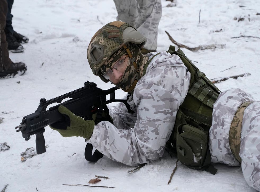 A member of Ukraine’s Territorial Defence Forces prepares for a potential Russian invasion (Efrem Lukatsky/AP)