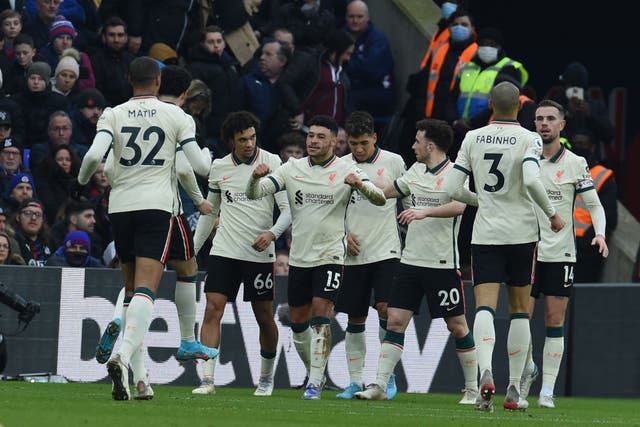 <p>Alex Oxlade-Chamberlain (centre) celebrates  after scoring Liverpool’s second goal at Selhurst Park </p>
