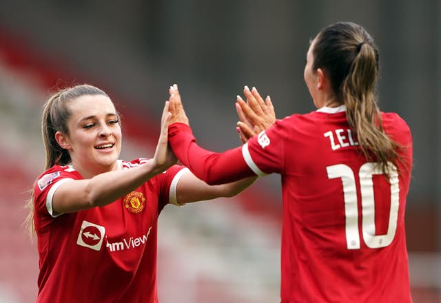 Manchester United’s Ella Toone (left) and Katie Zelem celebrate their side’s first goal of the game (Zac Goodwin/PA)