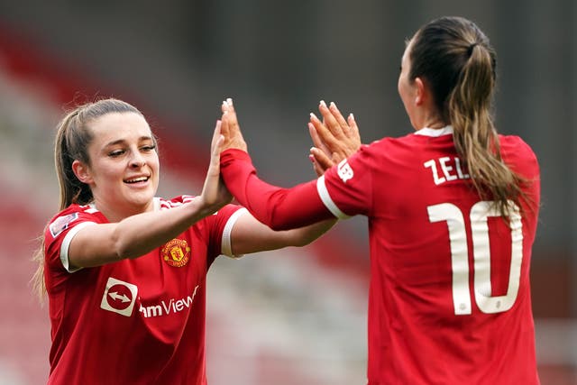 Manchester United’s Ella Toone (left) and Katie Zelem celebrate their side’s first goal of the game (Zac Goodwin/PA)