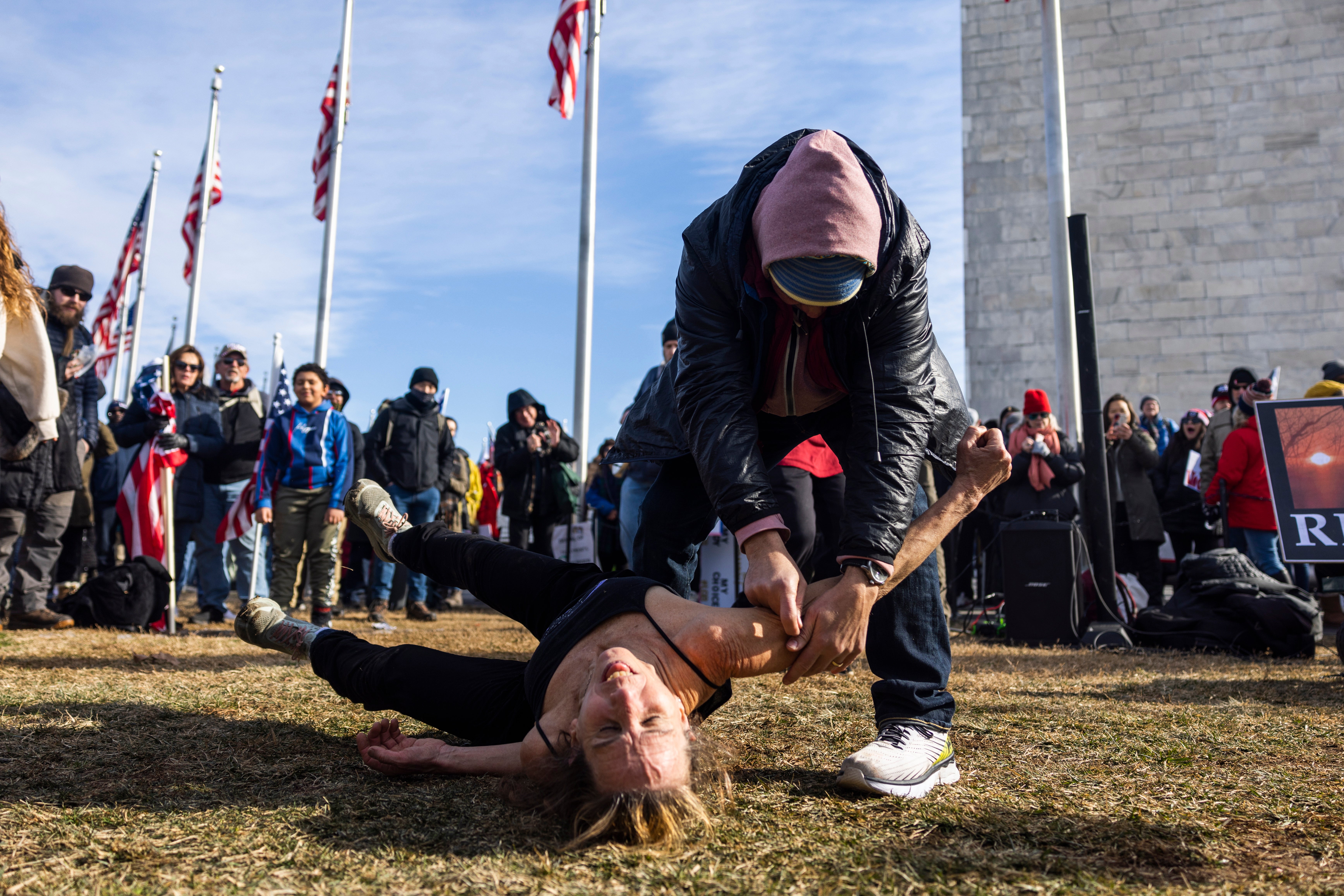 Anti-vaccine and mask activists act out getting a vaccine during a 'Defeat the Mandates' rally on the National Mall in Washington, DC, USA, 23 January 2022. Several thousand protesters attended the event, despite the Covid-19 vaccines proving to be safe and effective.