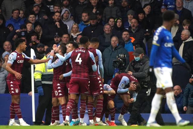 Aston Villa’s Matty Cash (second right) is hit with a bottle while celebrating the goal at Goodison Park (Peter Byrne/PA)
