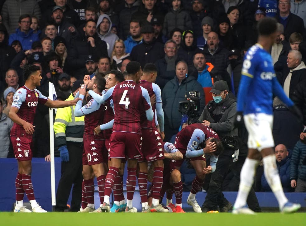 Aston Villa’s Matty Cash (second right) is hit with a bottle while celebrating the goal at Goodison Park (Peter Byrne/PA)