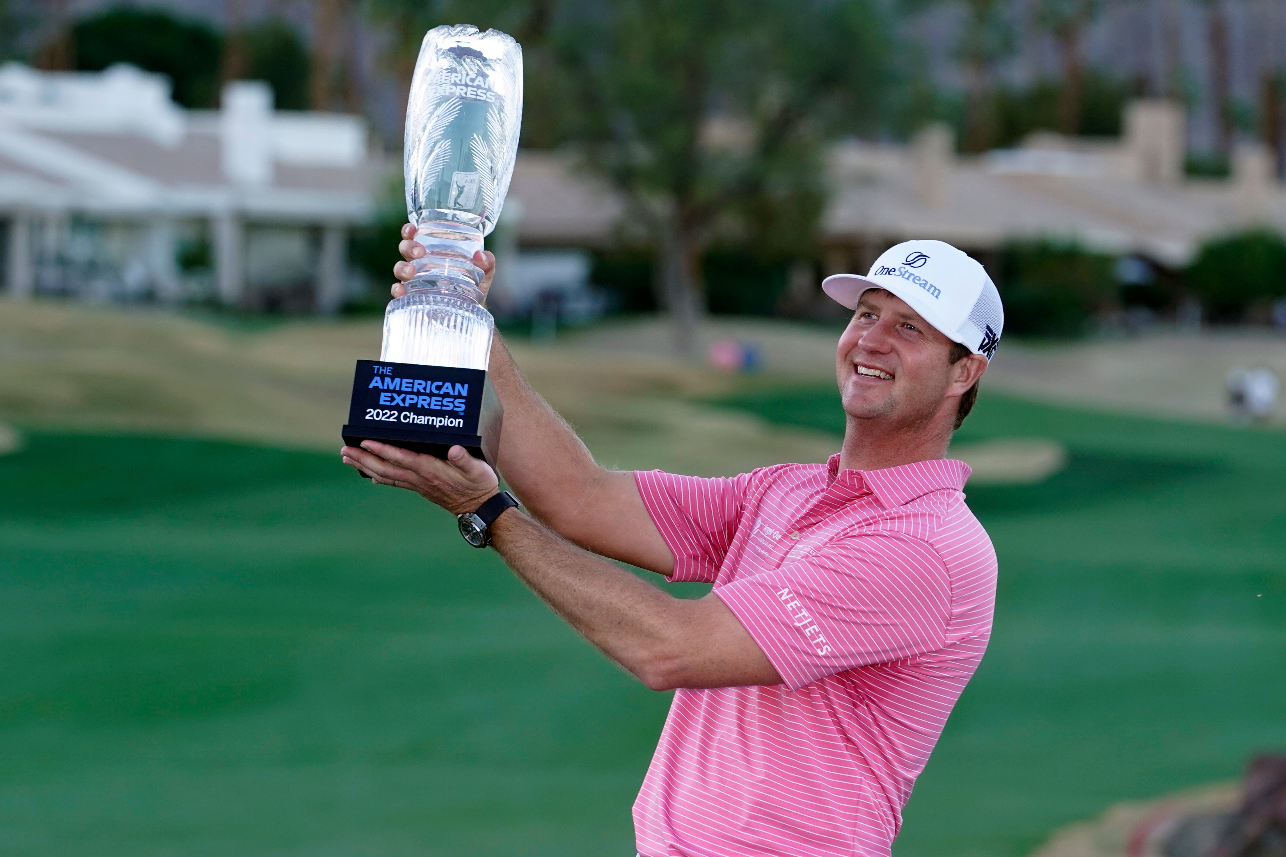 Hudson Swafford lifts the winner’s trophy at the end of the American Express in La Quinta, California (AP Photo/Marcio Jose Sanchez)