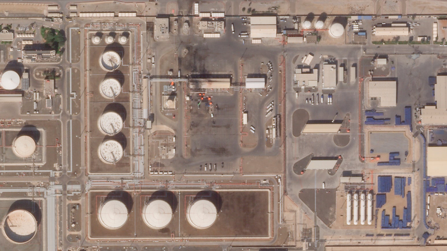 This satellite image provided by Planet Labs PBC shows the aftermath of an attack claimed by Yemen’s Houthi rebels on an Abu Dhabi National Oil Co. fuel depot on Jan. 22, 2022.