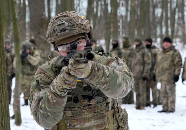 Members of Ukraine’s Territorial Defense Forces, volunteer military units of the Armed Forces, train in a city park in Kyiv, Ukraine, Saturday, Jan. 22, 2022. Dozens of civilians have been joining Ukraine’s army reserves in recent weeks amid fears about Russian invasion. (AP Photo/Efrem Lukatsky)