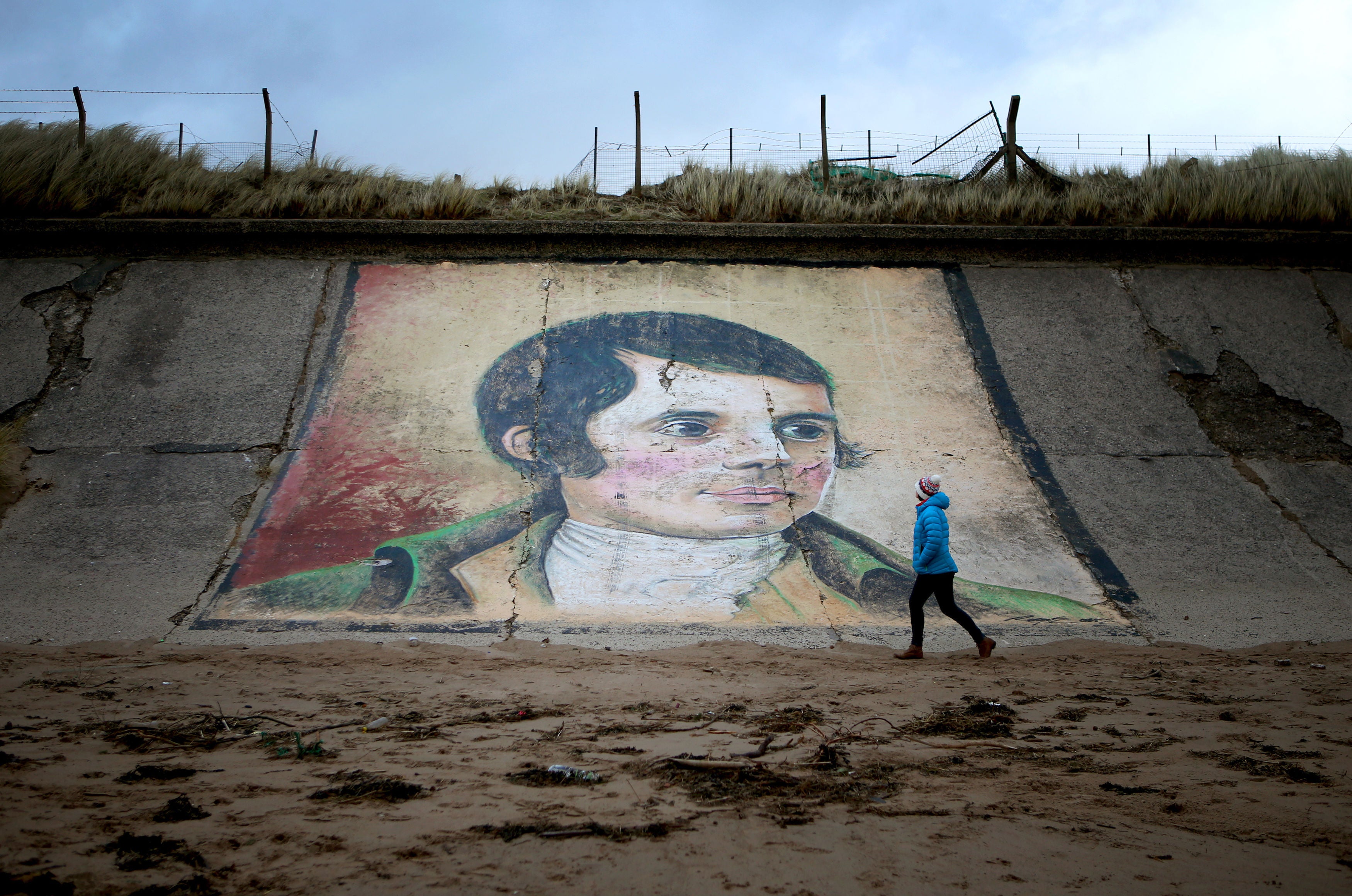 A mural of Robert Burns on the sea wall at Ardeer beach, near his birthplace of Alloway (Jane Barlow/PA)