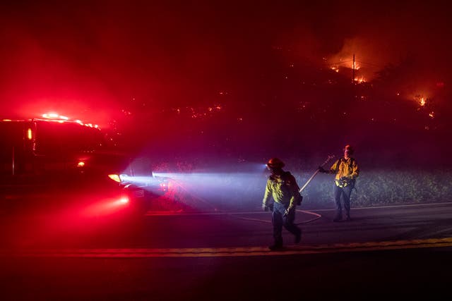 <p>Firefighters battle the Colorado Fire burning along Highway 1 in Big Sur, California. </p>