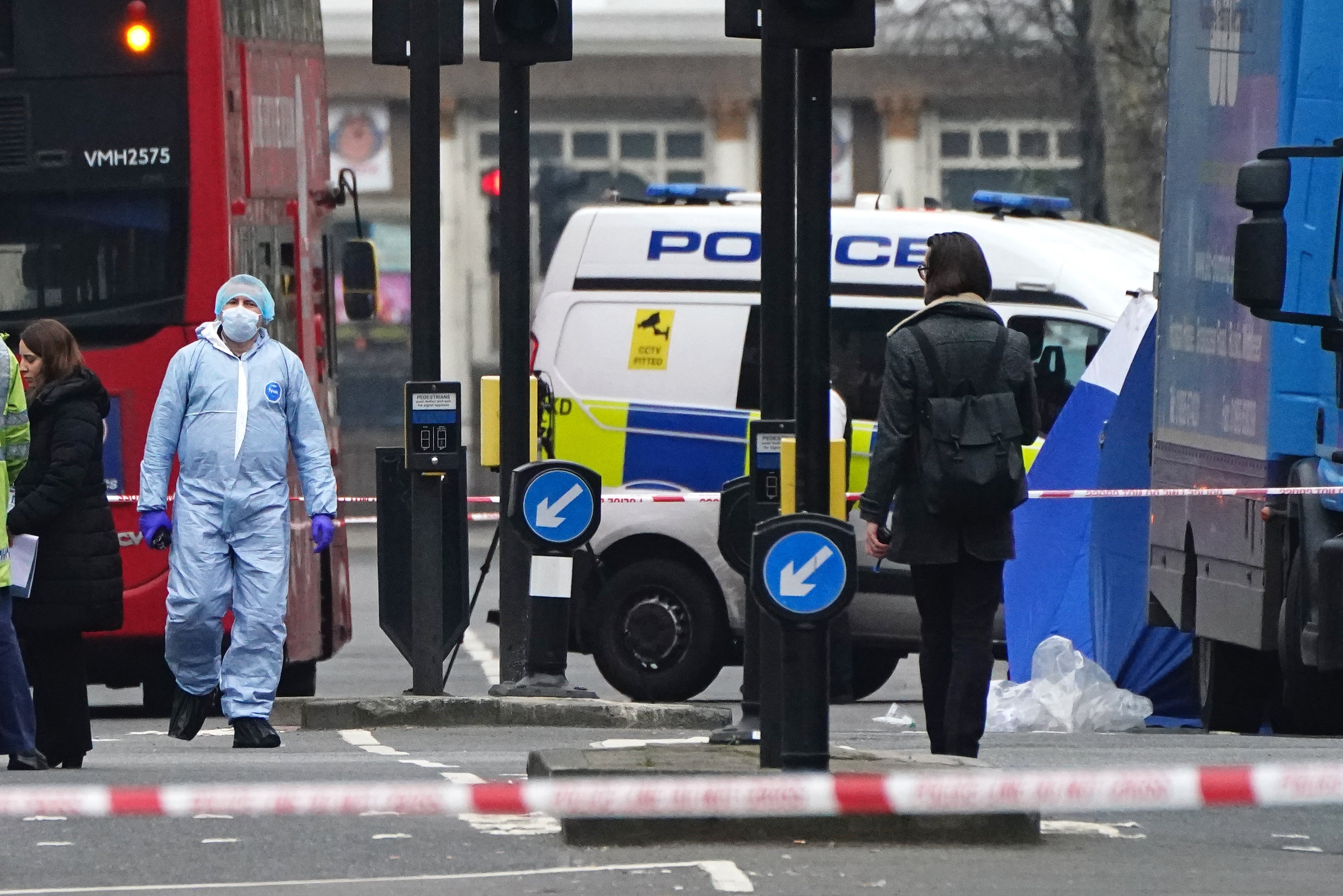 Metropolitan Police officers in a forensic suit at the scene on Chippenham Road, Maida Vale, west London (Aaron Chown/PA)