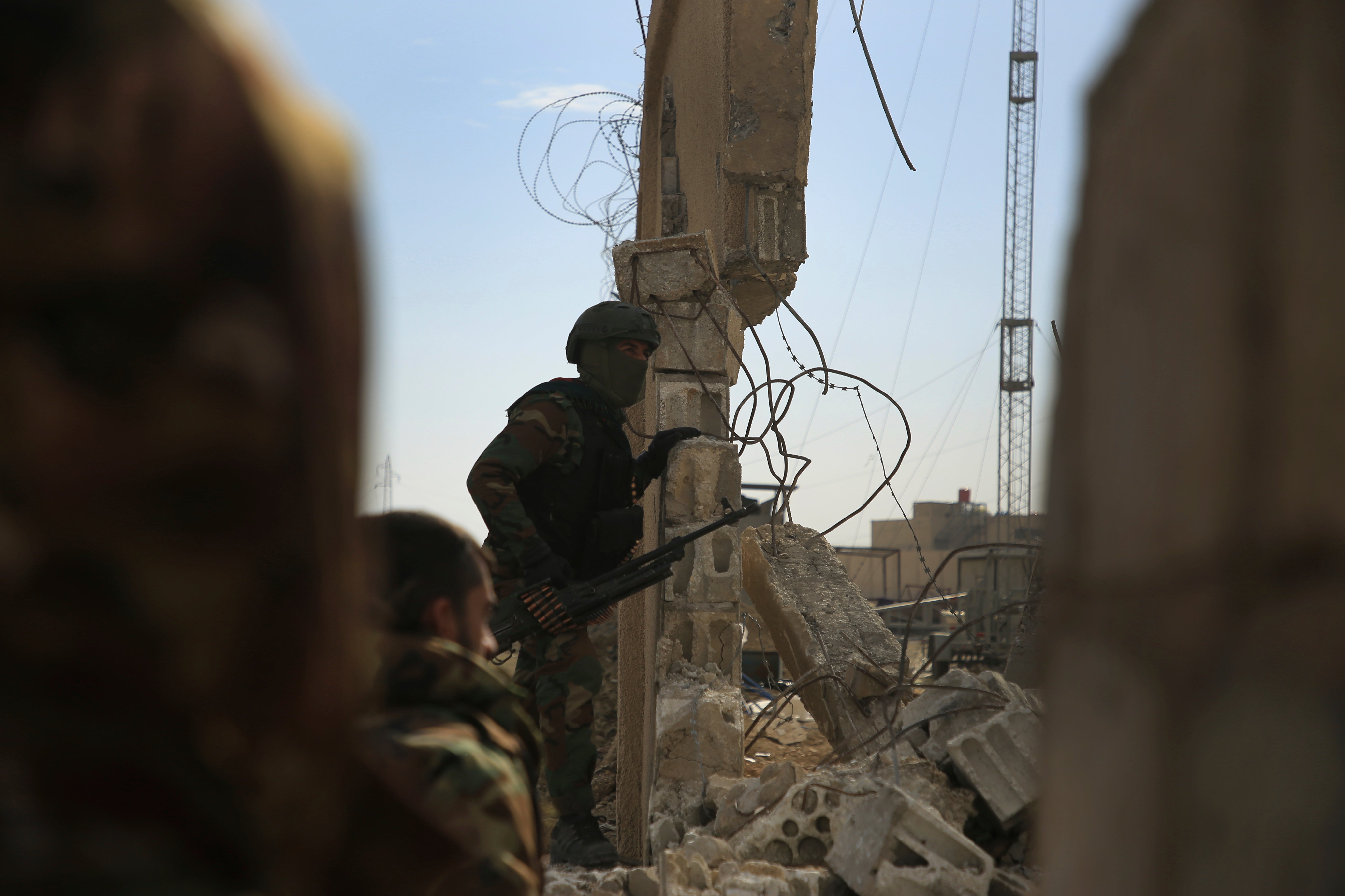 Kurdish-led Syrian Democratic Forces fighters take their positions at the defense wall of Gweiran prison in Hassakeh, northeast Syria, 23 January 2022