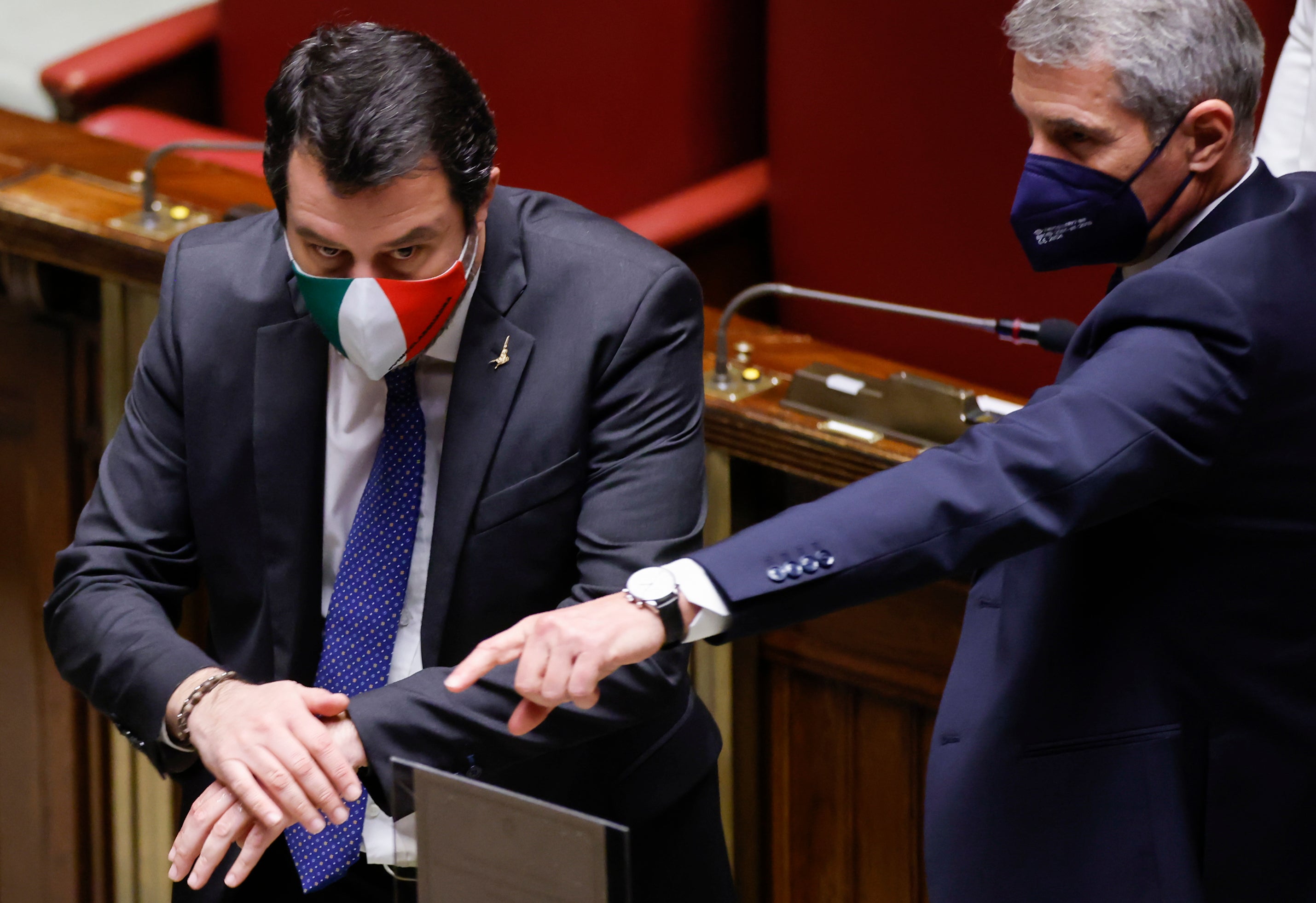 Member of Parliament Matteo Salvini, left, prepares to cast his ballot in the Italian parliament