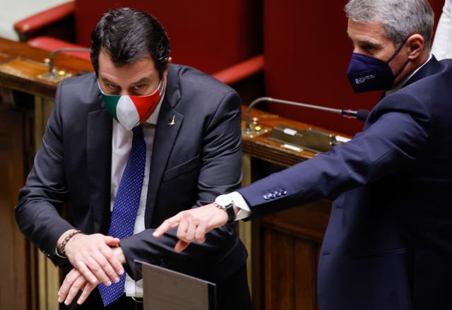 <p>Member of Parliament Matteo Salvini, left, prepares to cast his ballot in the Italian parliament</p>