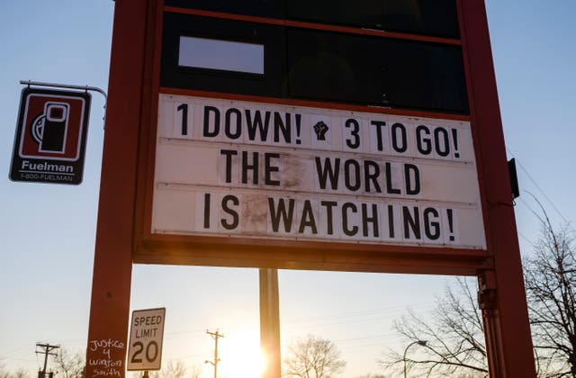 <p>A sign reads 1 Down! 3 To Go! at the memorial site known as George Floyd Square in Minneapolis, Minnesota</p>