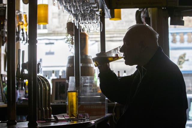 Customers can now enjoy a pint at the bar as Covid restrictions have eased for the hospitality sector in Scotland (Jane Barlow/PA)