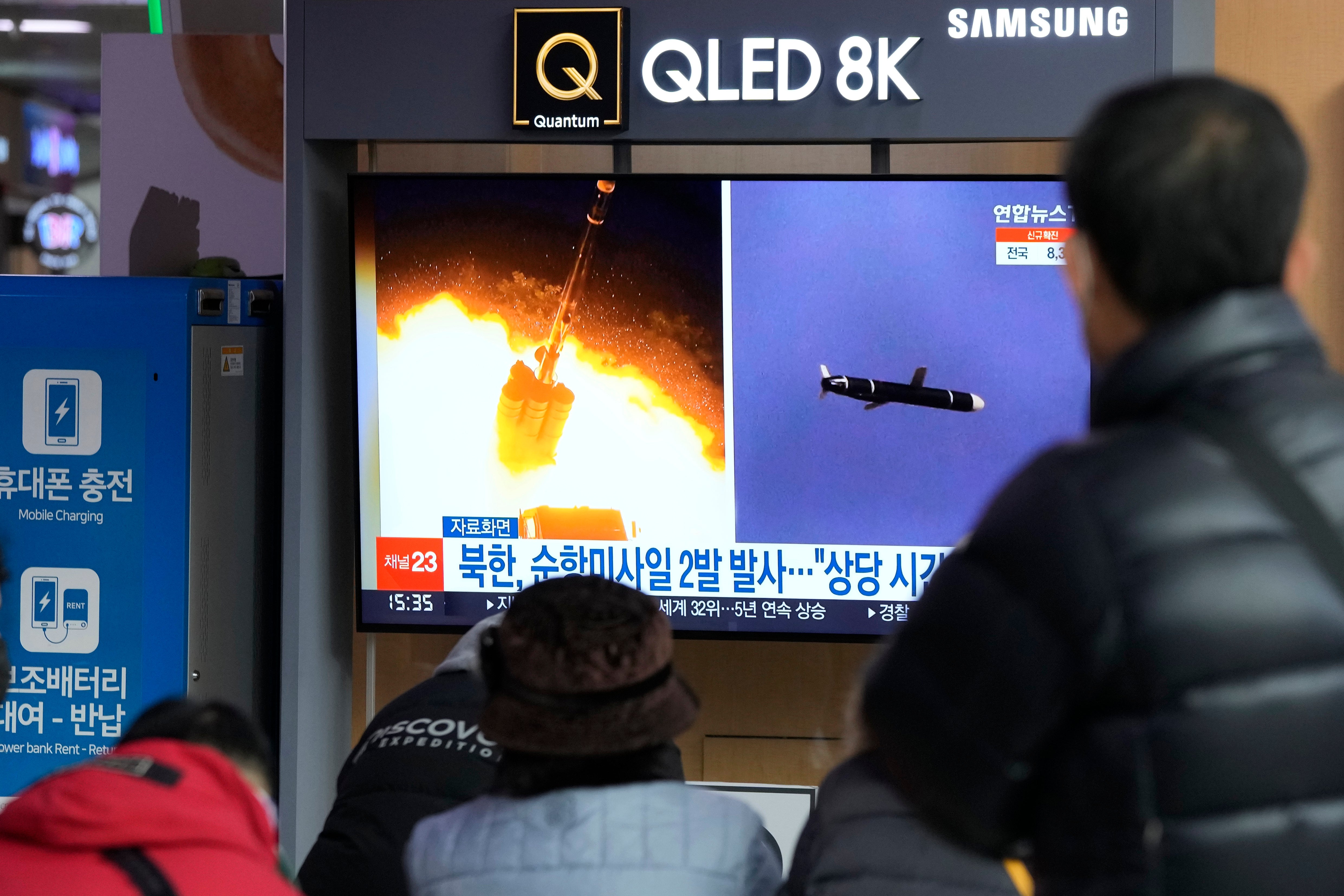 <p>File: People watch a TV showing file images of North Korea’s missile launch</p>