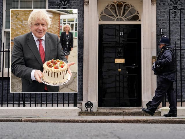 <p>Boris Johnson holds up a birthday cake during a visit to Bovingdon Primary Academy on 19 June 2020 </p>