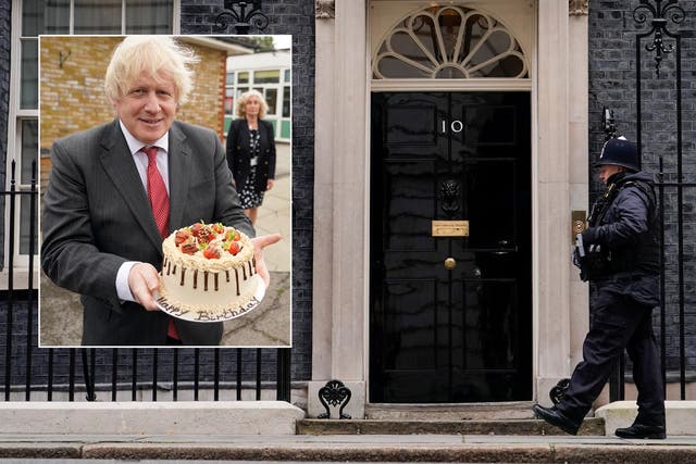 <p>Boris Johnson holds up a birthday cake during a visit to Bovingdon Primary Academy on 19 June 2020 </p>