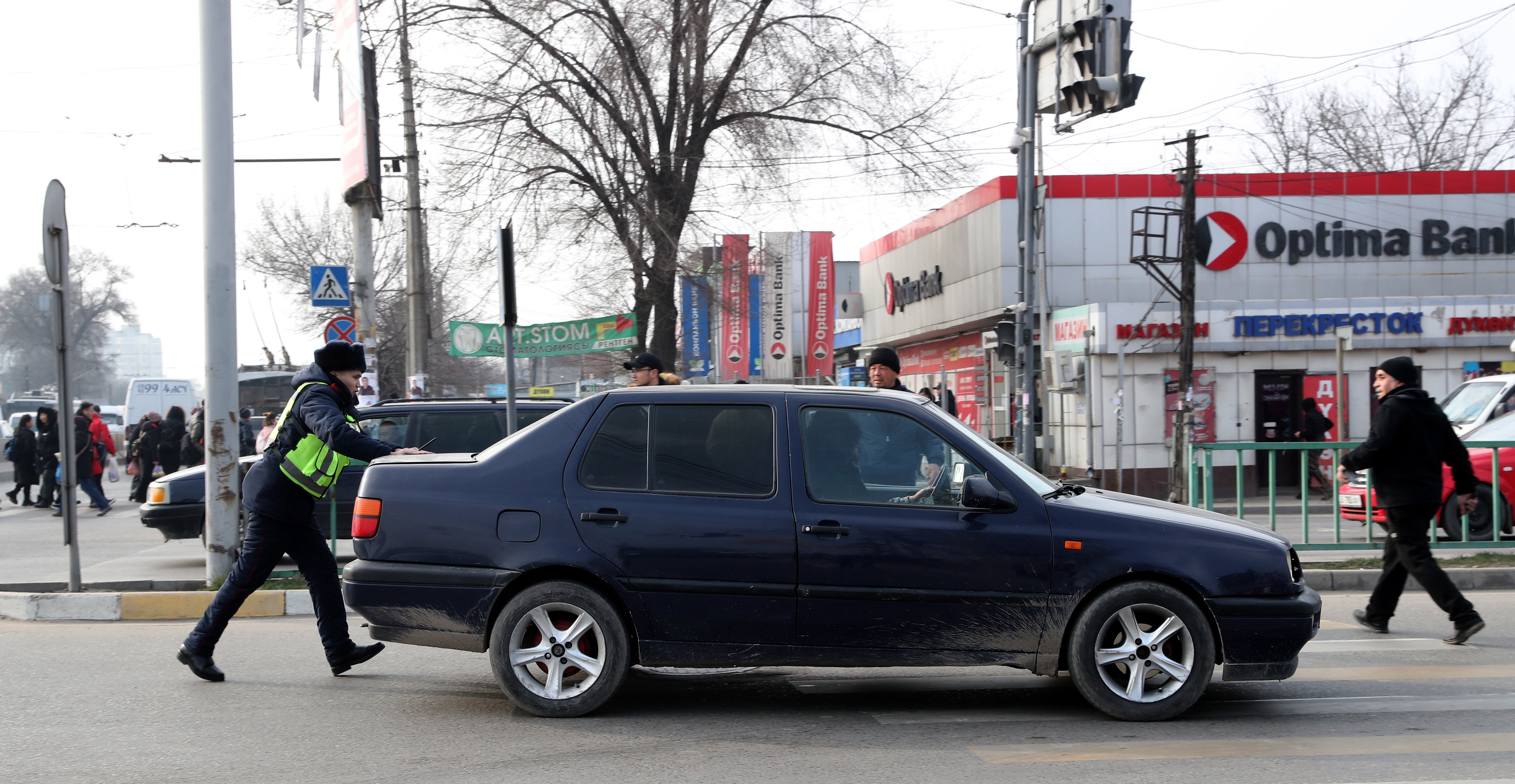 A policeman regulates traffic during a power outage in Bishkek, Kyrgyzstan, on 25 January 2022