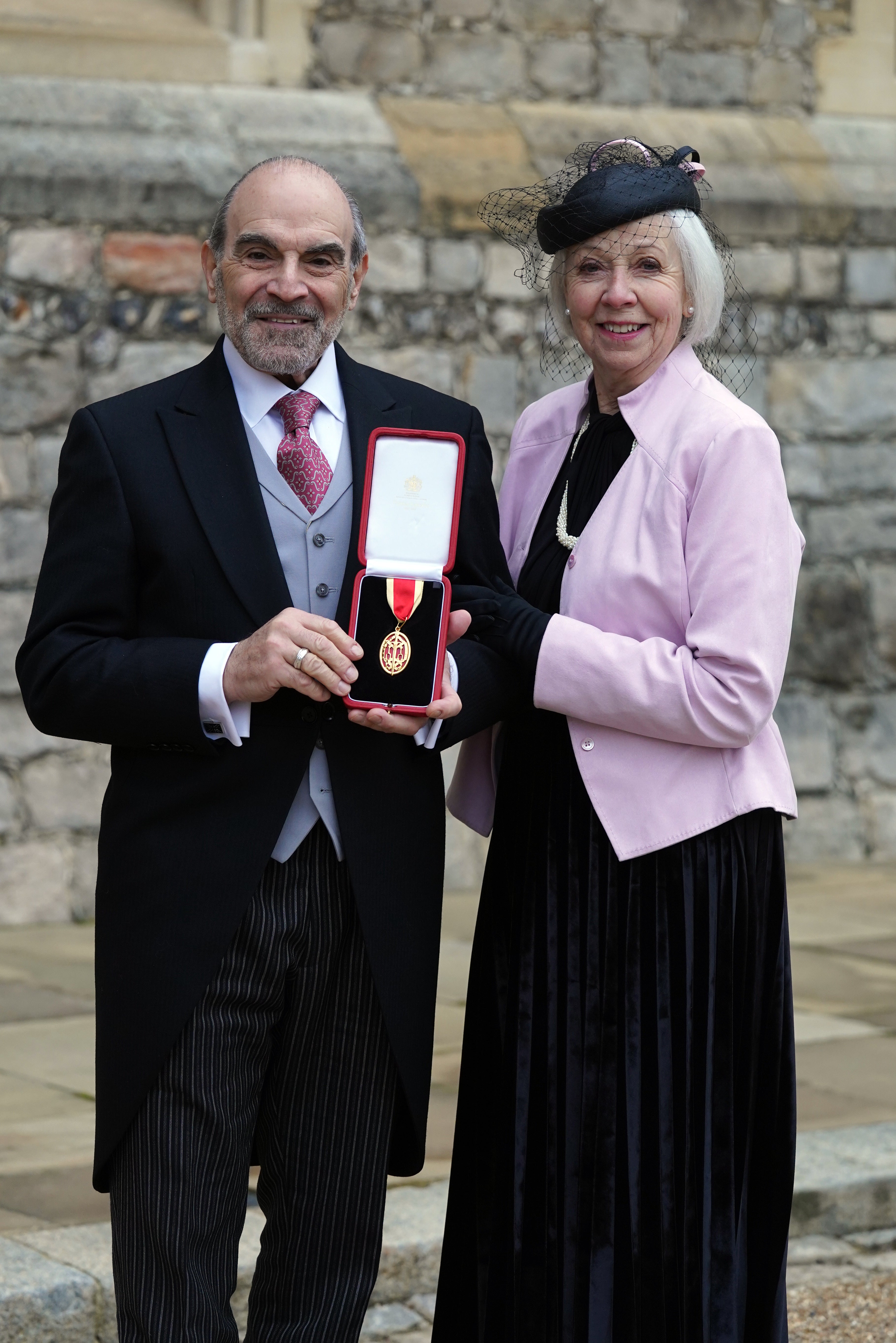 Sir David Suchet and his wife, Sheila Ferris, after he received his knighthood at Windsor Castle (Steve Parsons/PA)