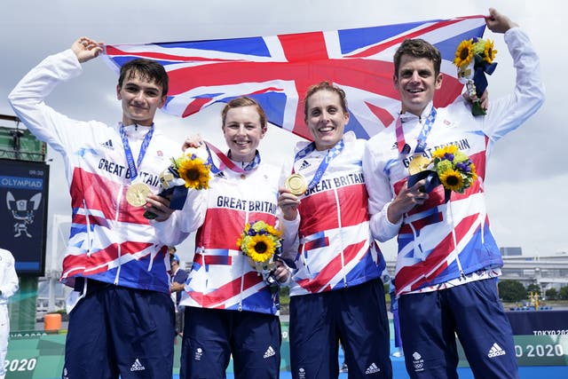 Alex Yee, left, Georgia Taylor-Brown, second left, and Jonny Brownlee, right, will team back up in triathlon’s mixed relay at Birmingham 2022 (Danny Lawson/PA)