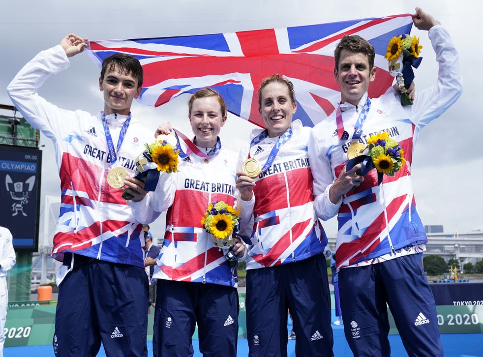 Alex Yee, left, Georgia Taylor-Brown, second left, and Jonny Brownlee, right, will team back up in triathlon’s mixed relay at Birmingham 2022 (Danny Lawson/PA)