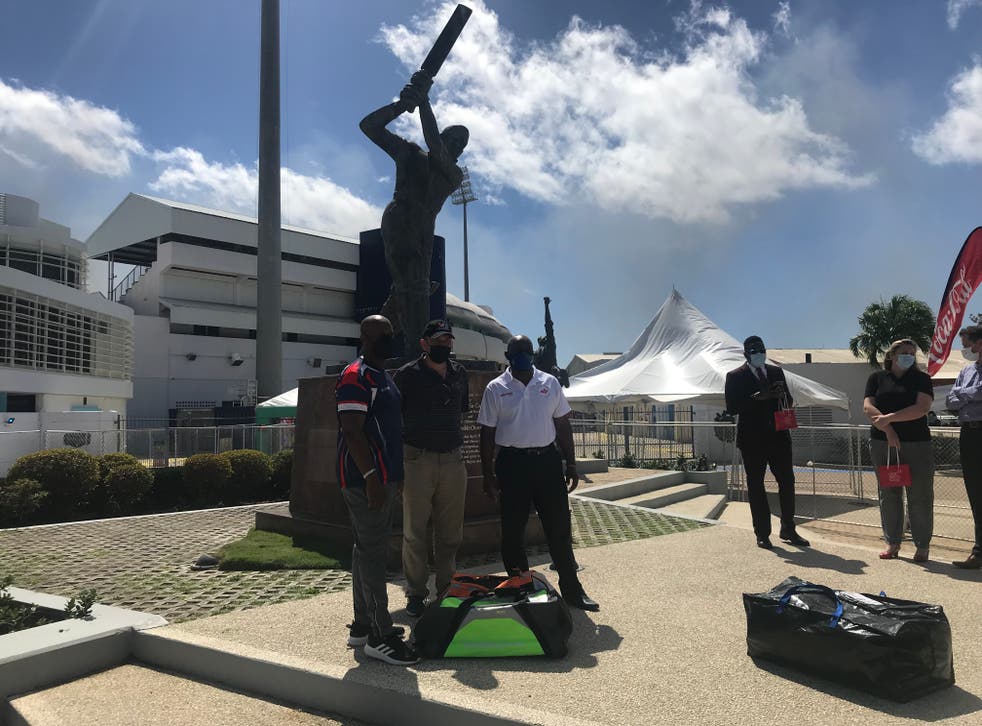 Roland Butcher, right, was speaking at an event outside the Kensington Oval in Barbados (PA)