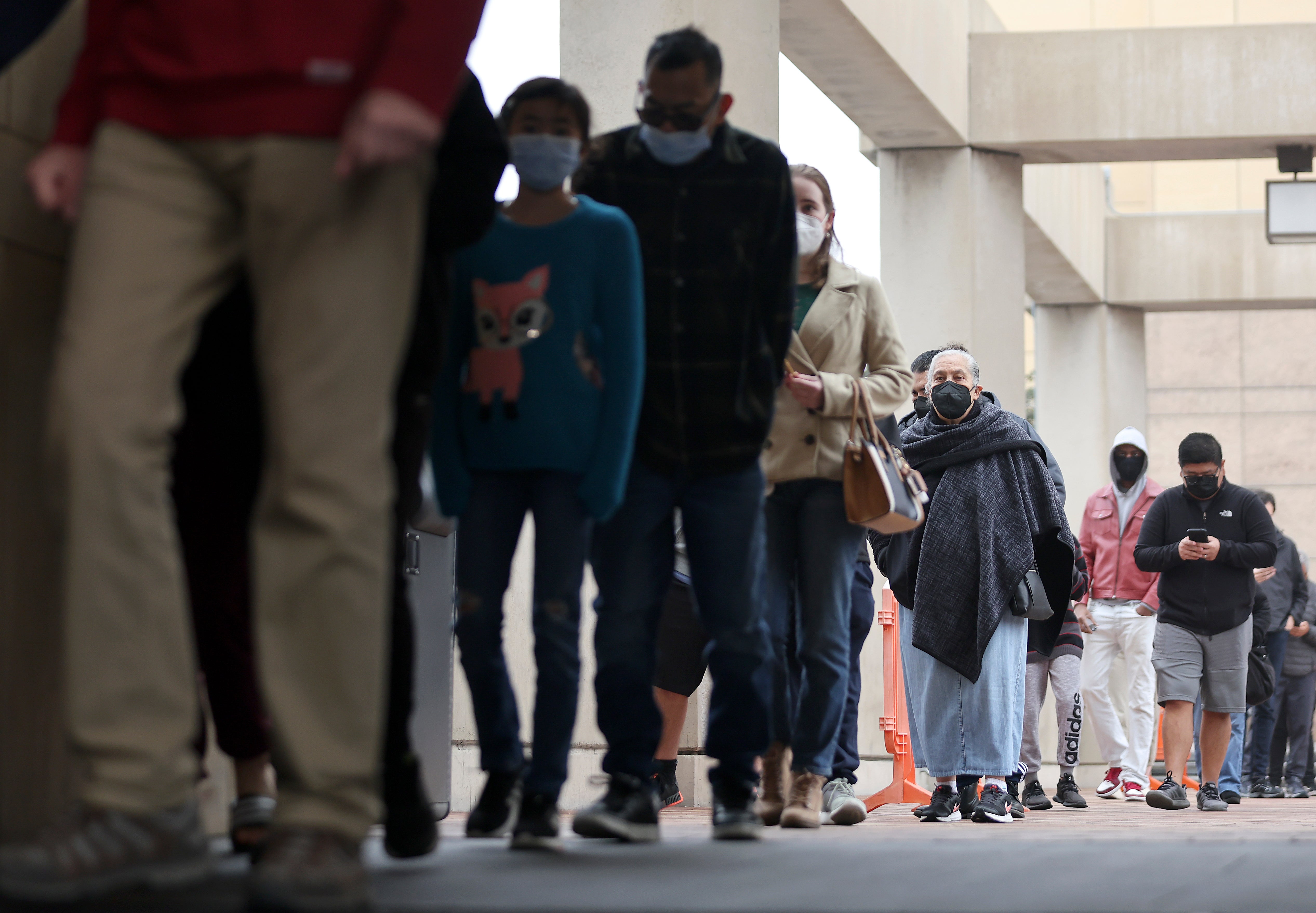 People wait in line to be tested for Covid-19 at Union Station on 7 January 2022 in Los Angeles, California
