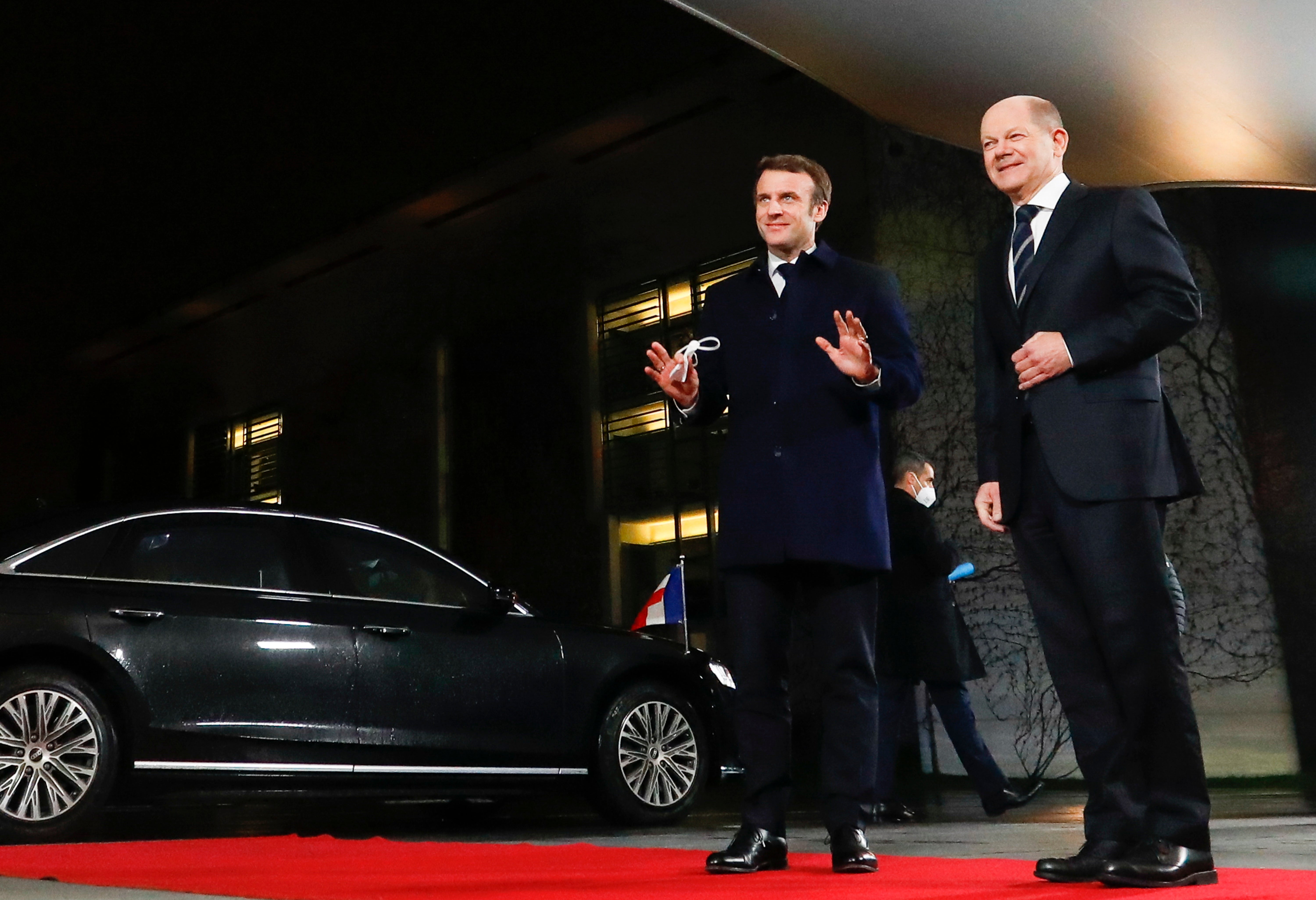 German chancellor Olaf Scholz (R) welcomes French president Emmanuel Macron (L) ahead of their meeting at the Federal Chancellery in Berlin, Germany