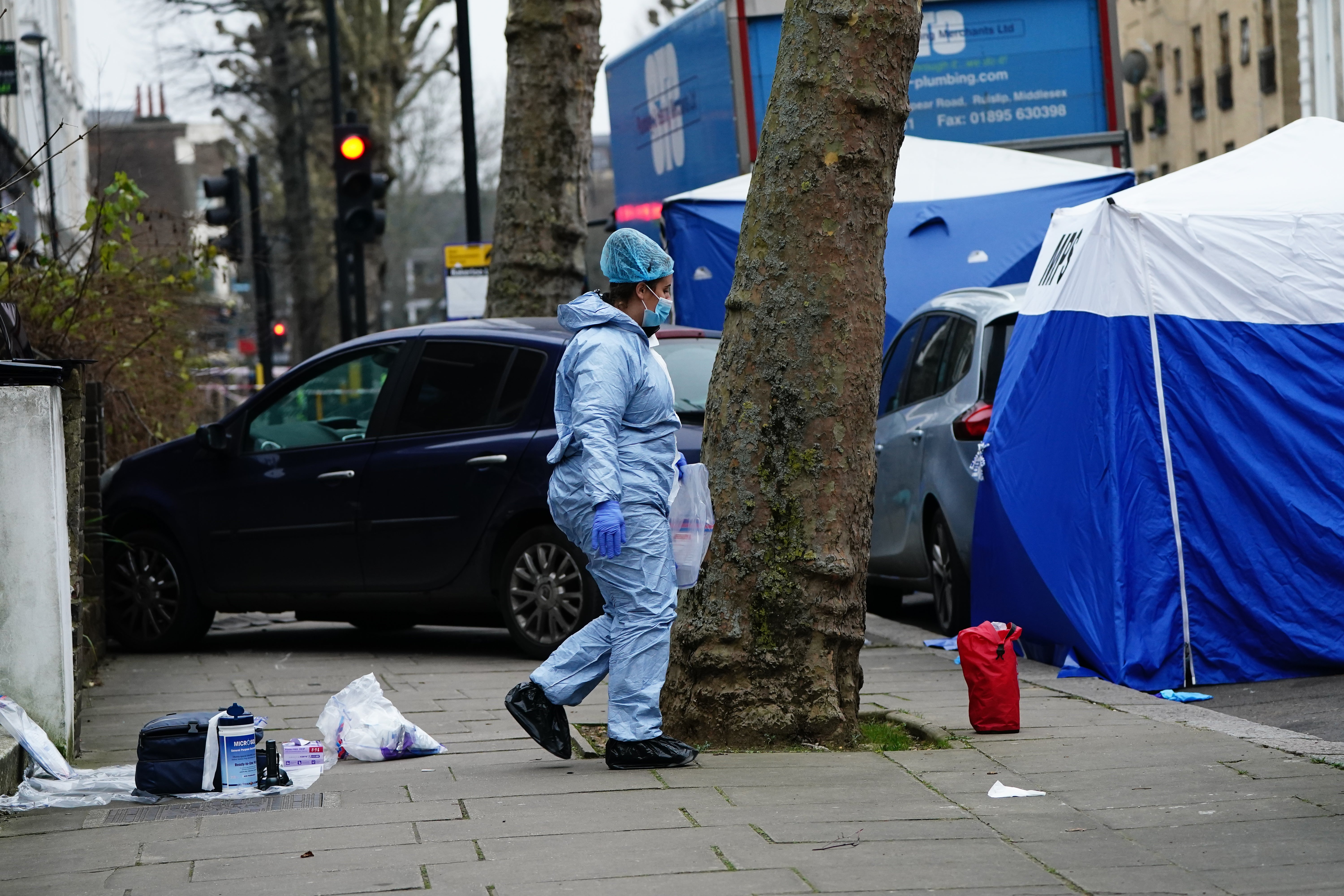 Police working at the scene of the deaths in Maida Vale, west London on Monday (Aaron Chown/PA)