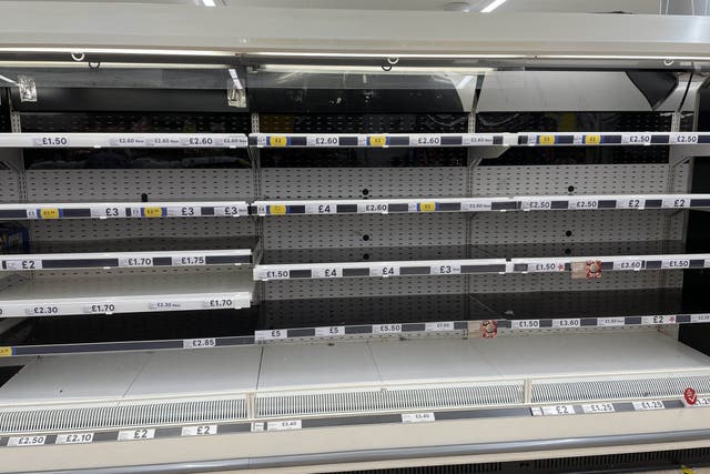 <p>Empty shelves in the meat aisle of a branch of Tesco in Liverpool in September (PA)</p>