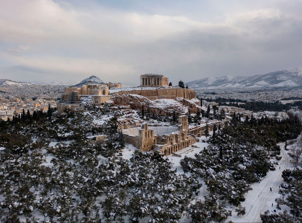 <p>The snow covered Ancient Temple of Parthenon atop the Acropolis hill </p>