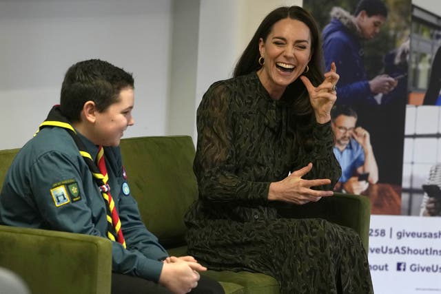 The Duchess of Cambridge sits beside scout Leo Street during a visit to Shout in London (Alastair Grant/PA)