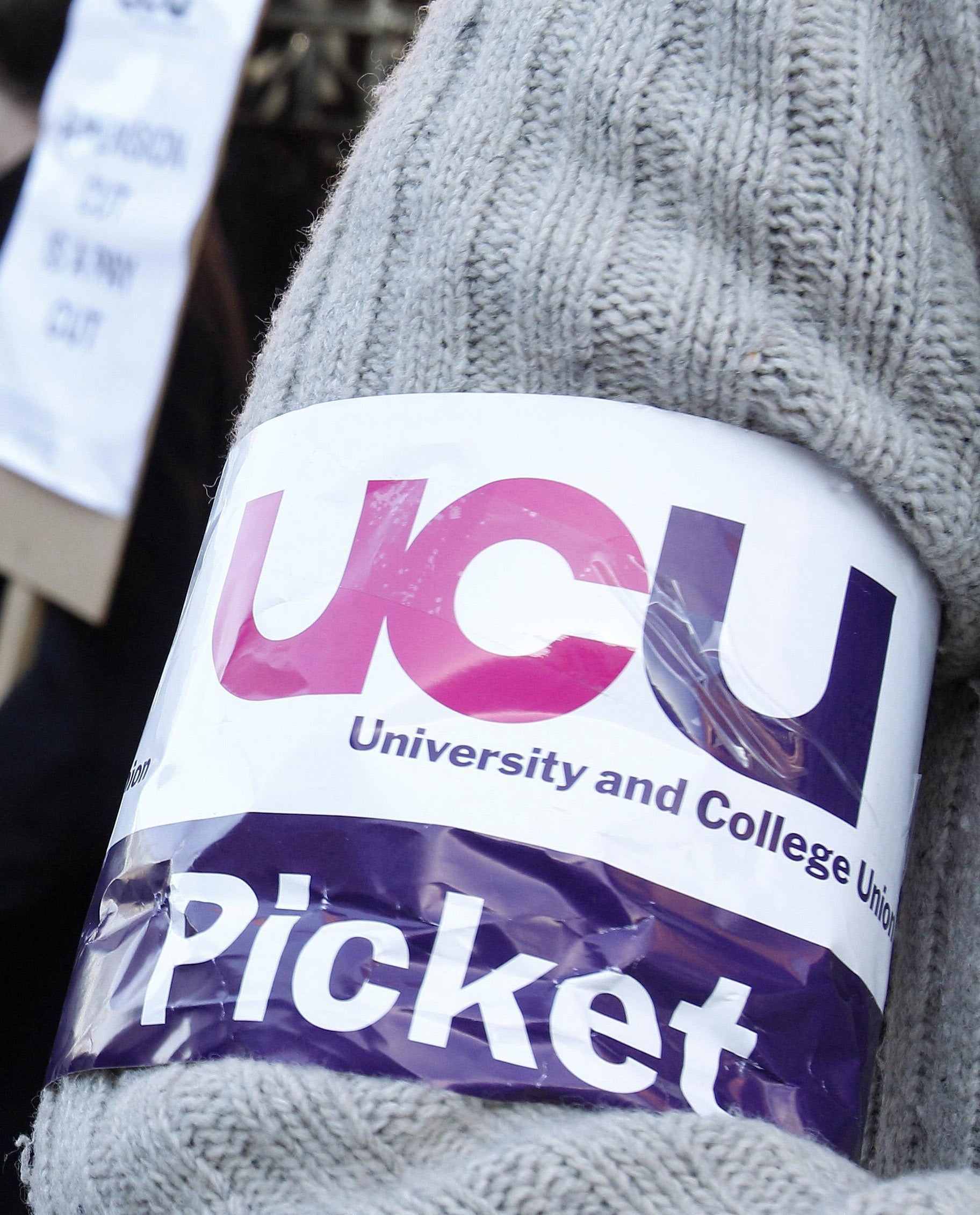 A University and College Union (UCU) arm band (Peter Byrne/PA)