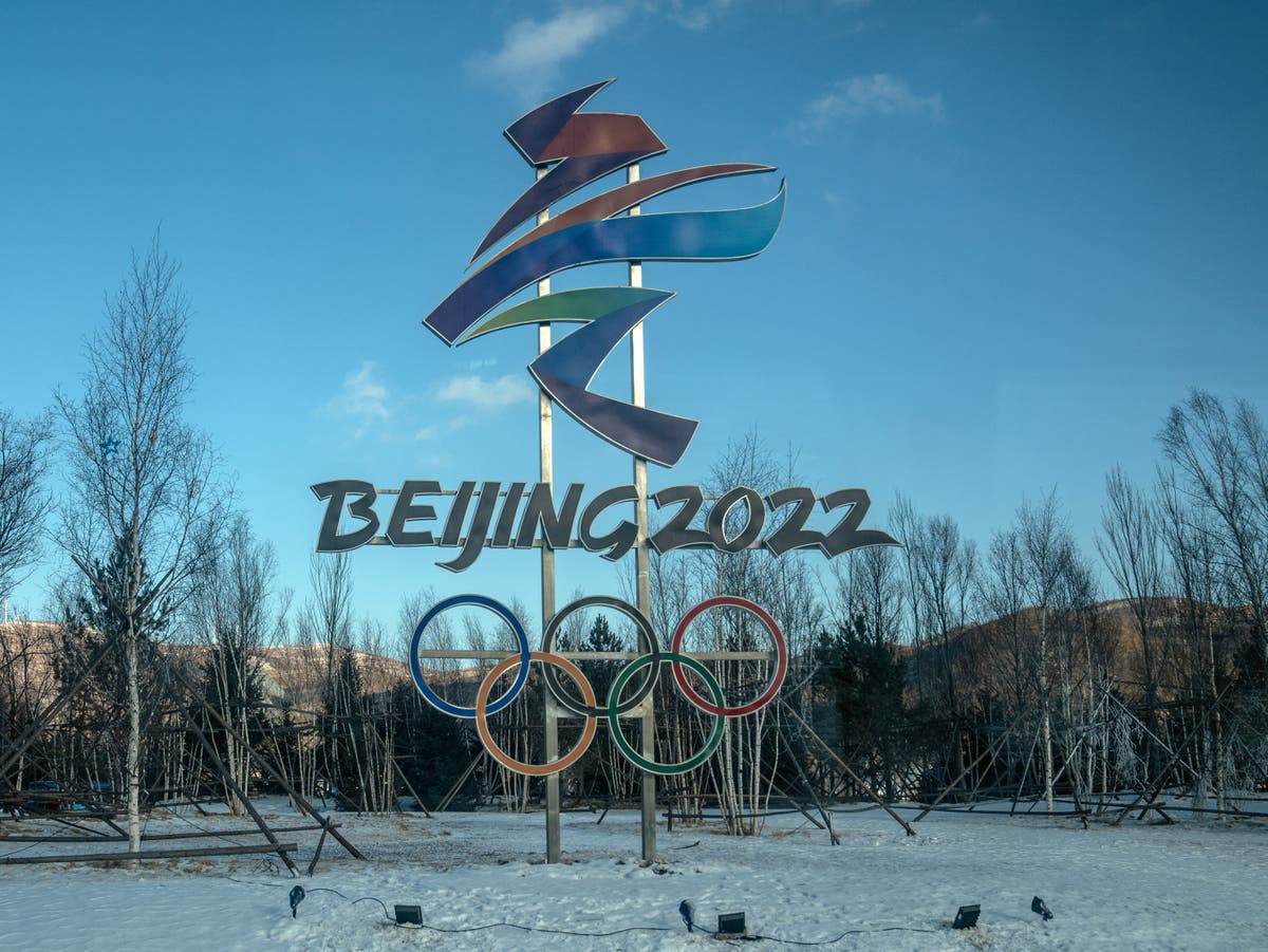 Hugs discouraged but condoms available to athletes at Beijing Games