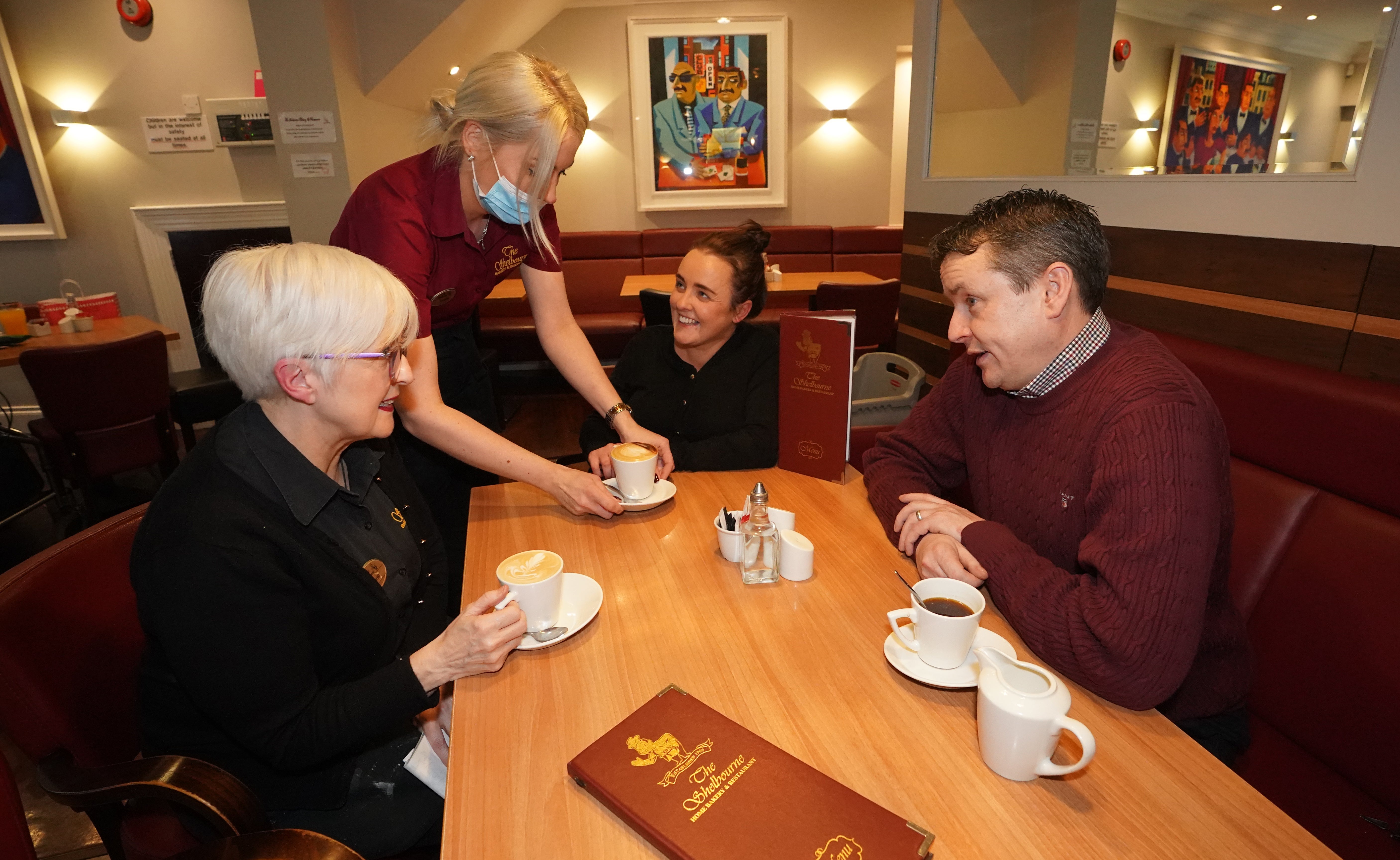 L-R Marie Rice, Lelda Viksna, Lisa McAvoy and Hugh Boyle at the Shelbourne bakery in Newry Co Down as the requirement for vaccine passports in restaurants is dropped in Northern Ireland (Niall Carson/PA)