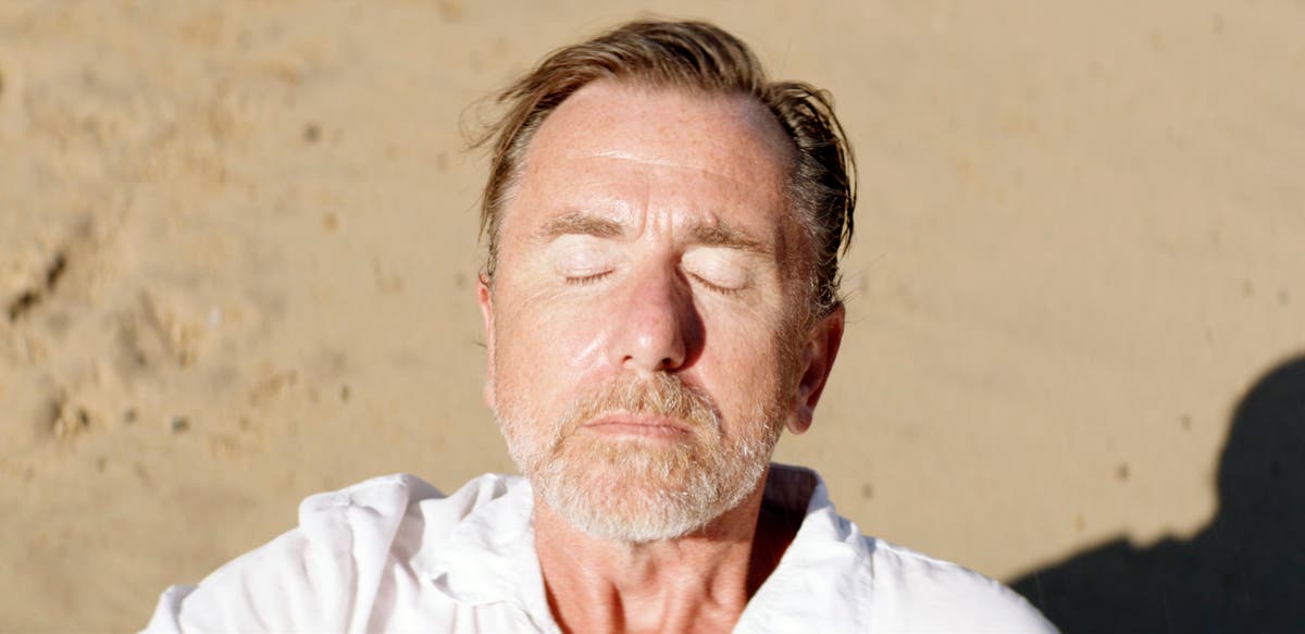 Review: Tim Roth drops out, in paradise, in ‘Sundown’