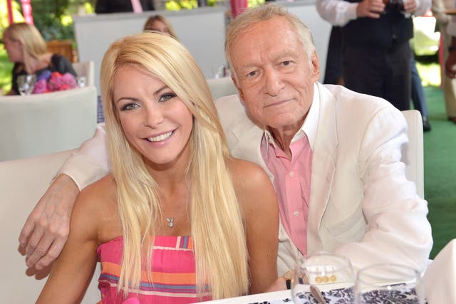 <p>Crystal Hefner and Hugh Hefner at a Playboy luncheon on 9 May 2013 at the Playboy mansion in Holmby Hills, California</p>