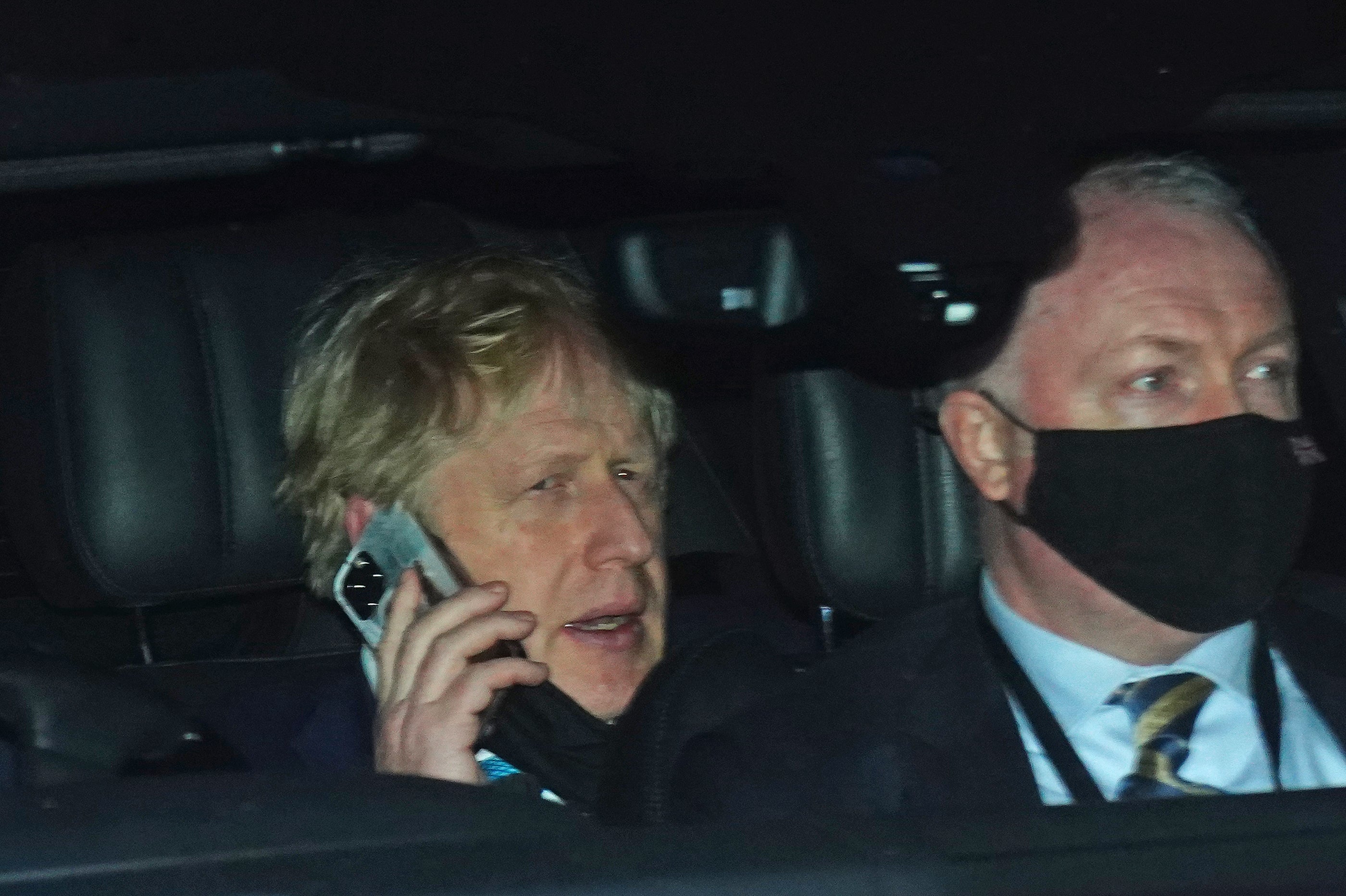 Prime Minister Boris Johnson rides in the back seat of a Government car (Victoria Jones/PA)