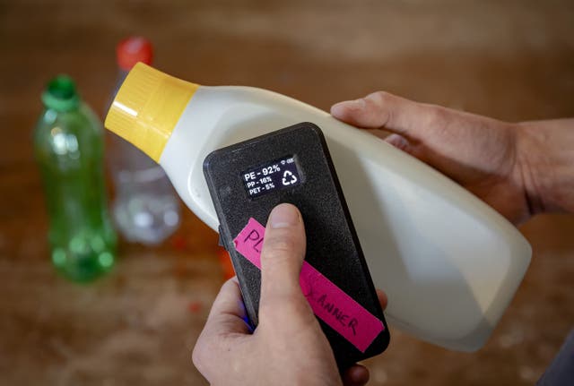 <p>Dutch student Jerry de Vos shows his invention, a plastic scanner that identifies what type of plastic a product is made of, for which he was awarded the 2021 James Dyson award for Sustainability</p>