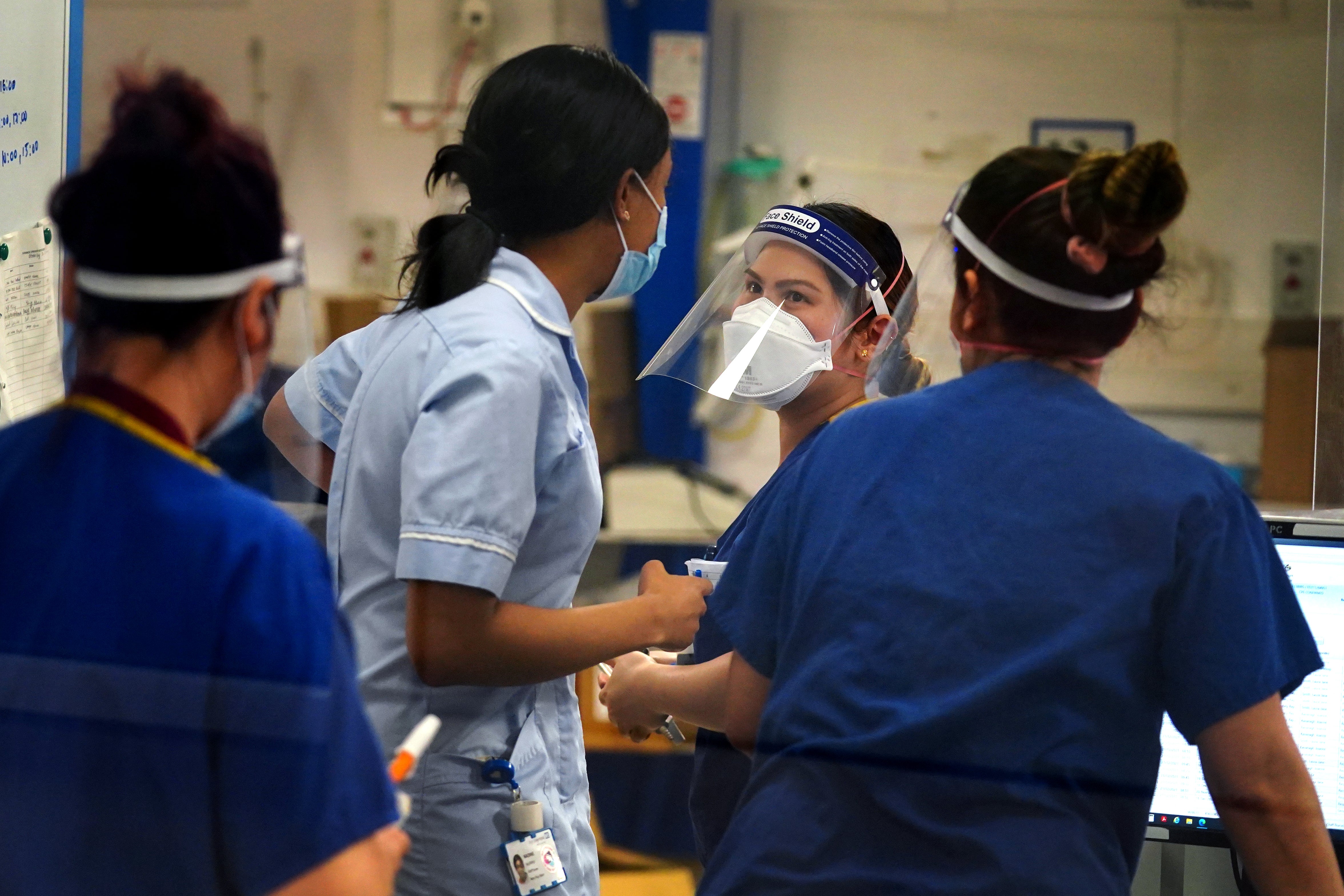 Medical staff wearing PPE on a ward for Covid patients at King’s College Hospital, in south east London (Victoria Jones/PA)