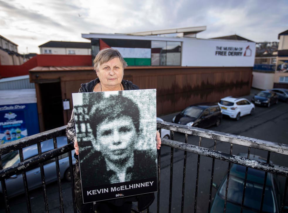 Kevin McElhinney’s sister Jean Hegarty holds an image of her brother outside the Bogside Museum in Londonderry (Liam McBurney/PA)