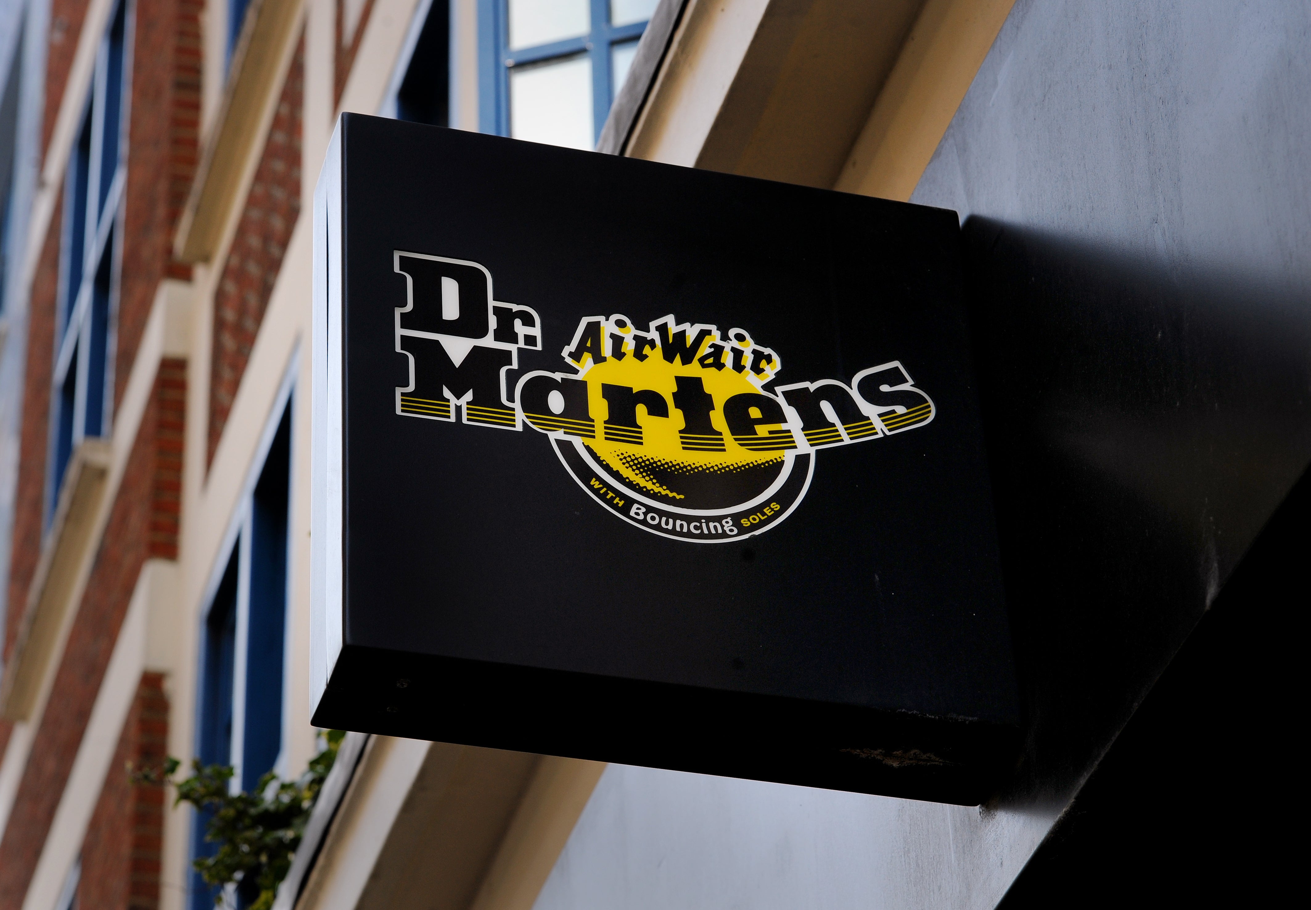 General view of a Dr Martens sign on the front of their shop in London The retailer saw shares slide after it posted a slowdown in sales over the latest quarter (Lauren Hurley/PA)