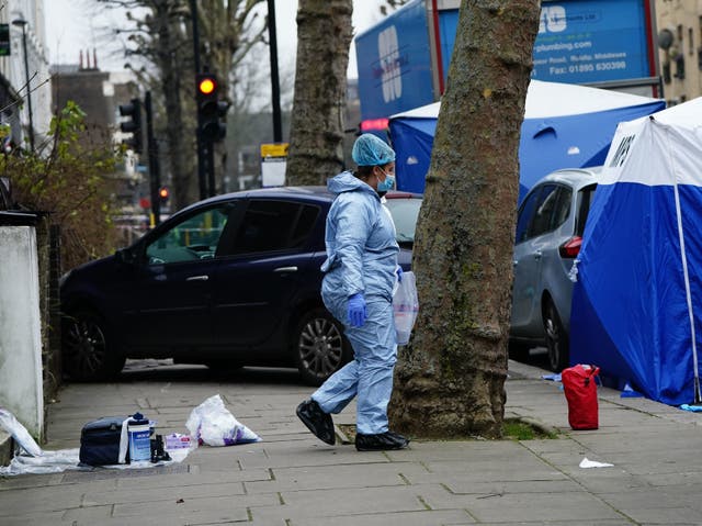 <p>A driver who ran over a knifeman to stop him stabbing his ex-wife to death in a London street has urged police to drop their murder investigation </p>