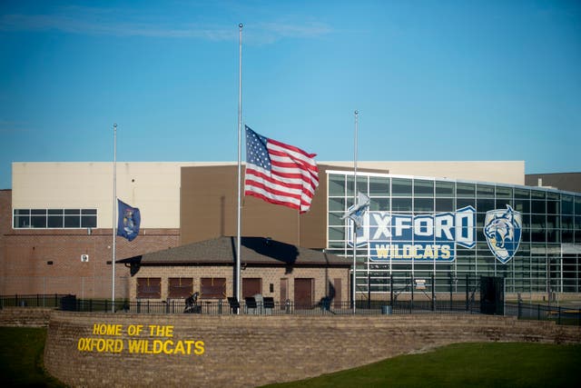 <p>The American flag flies at half mast as Oxford High School reopens for the first time on Monday  </p>