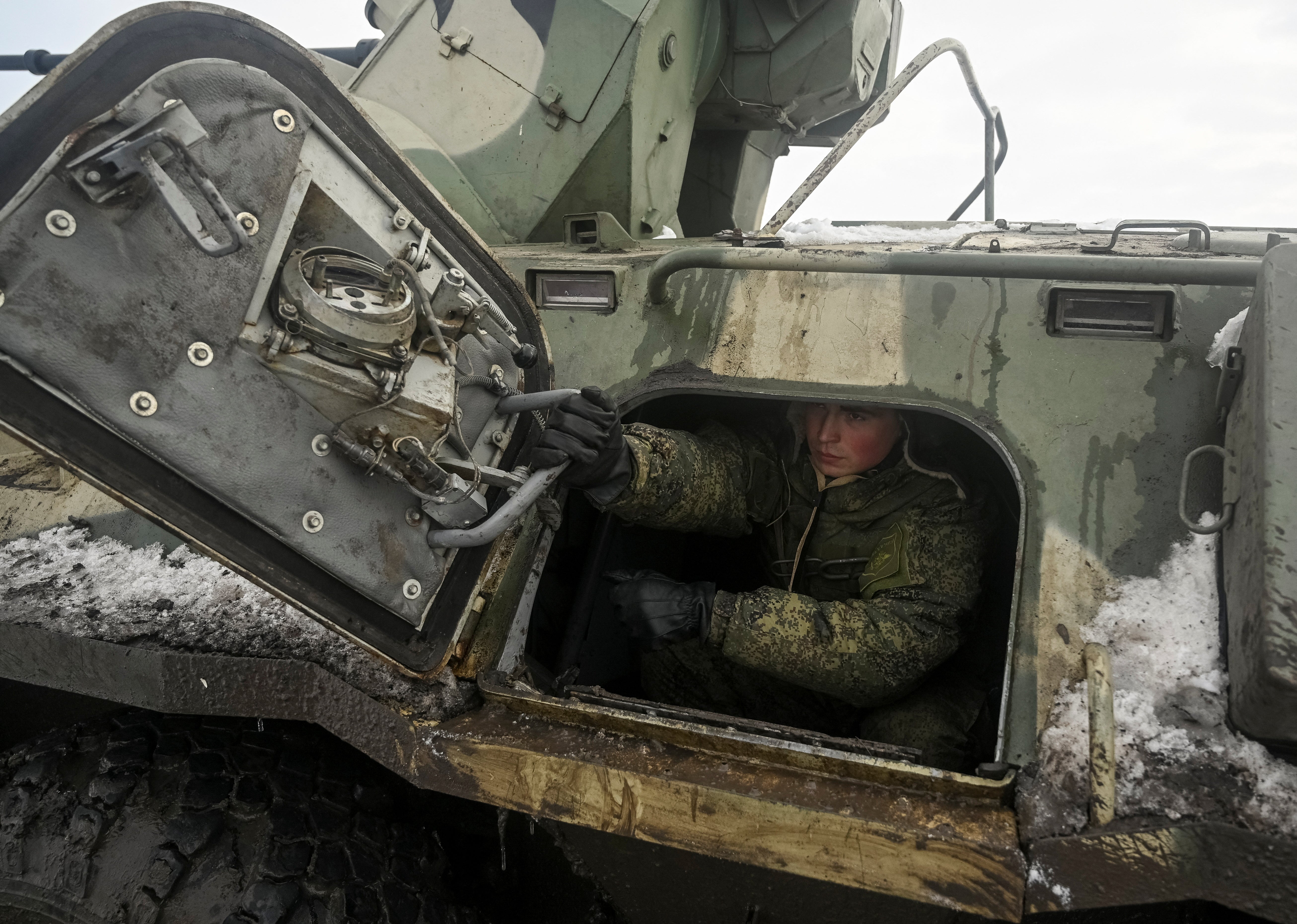 A Russian army service member is seen inside an armoured personnel carrier BTR-82 during drills at the Kuzminsky range in the southern Rostov region, on 26 January